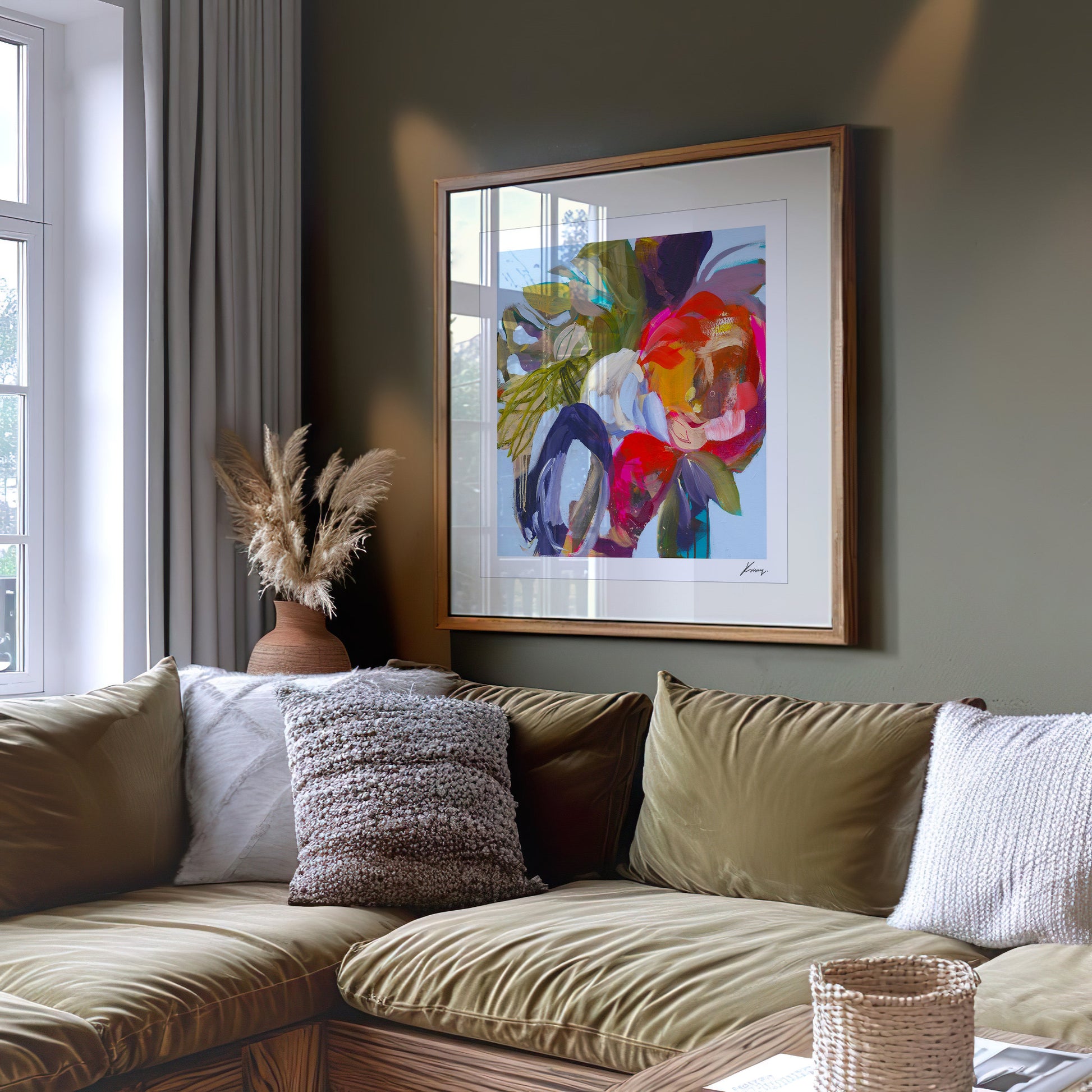 Living room with a sectional sofa, decorative pillows, and a colorful abstract painting on the wall.