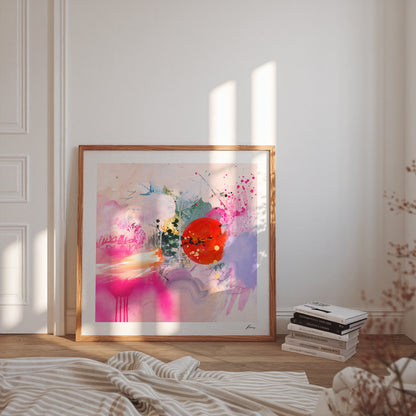 Framed abstract art print in a bedroom with books