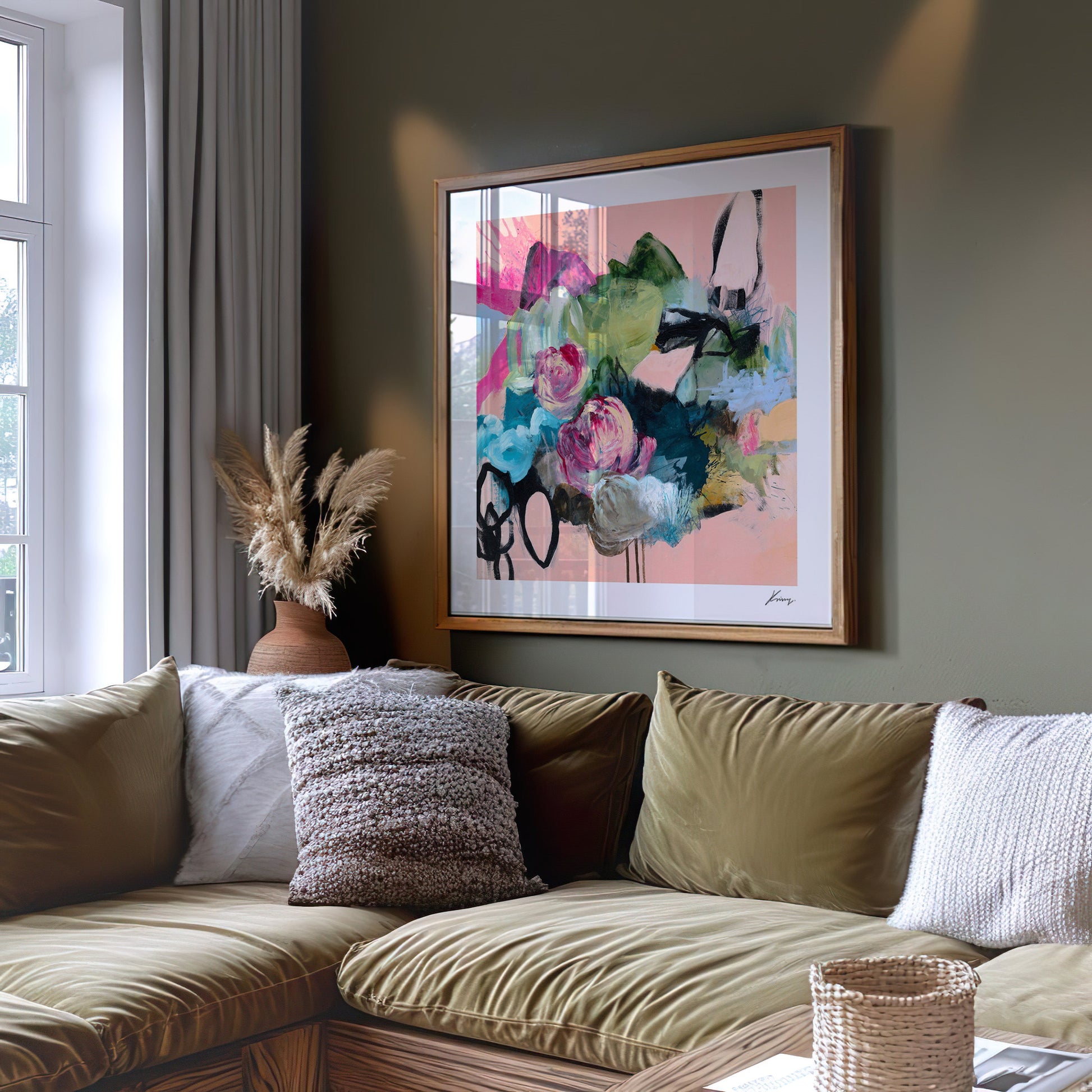 Living room with a beige sofa, decorative pillows, and a colorful abstract painting on the wall.