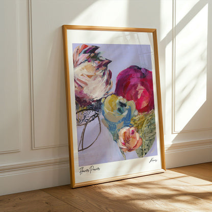 Framed floral painting on a wall with sunlight casting shadows