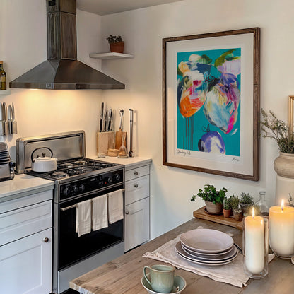 Kitchen with stove, utensils, and decorative elements including a colorful painting on the wall.