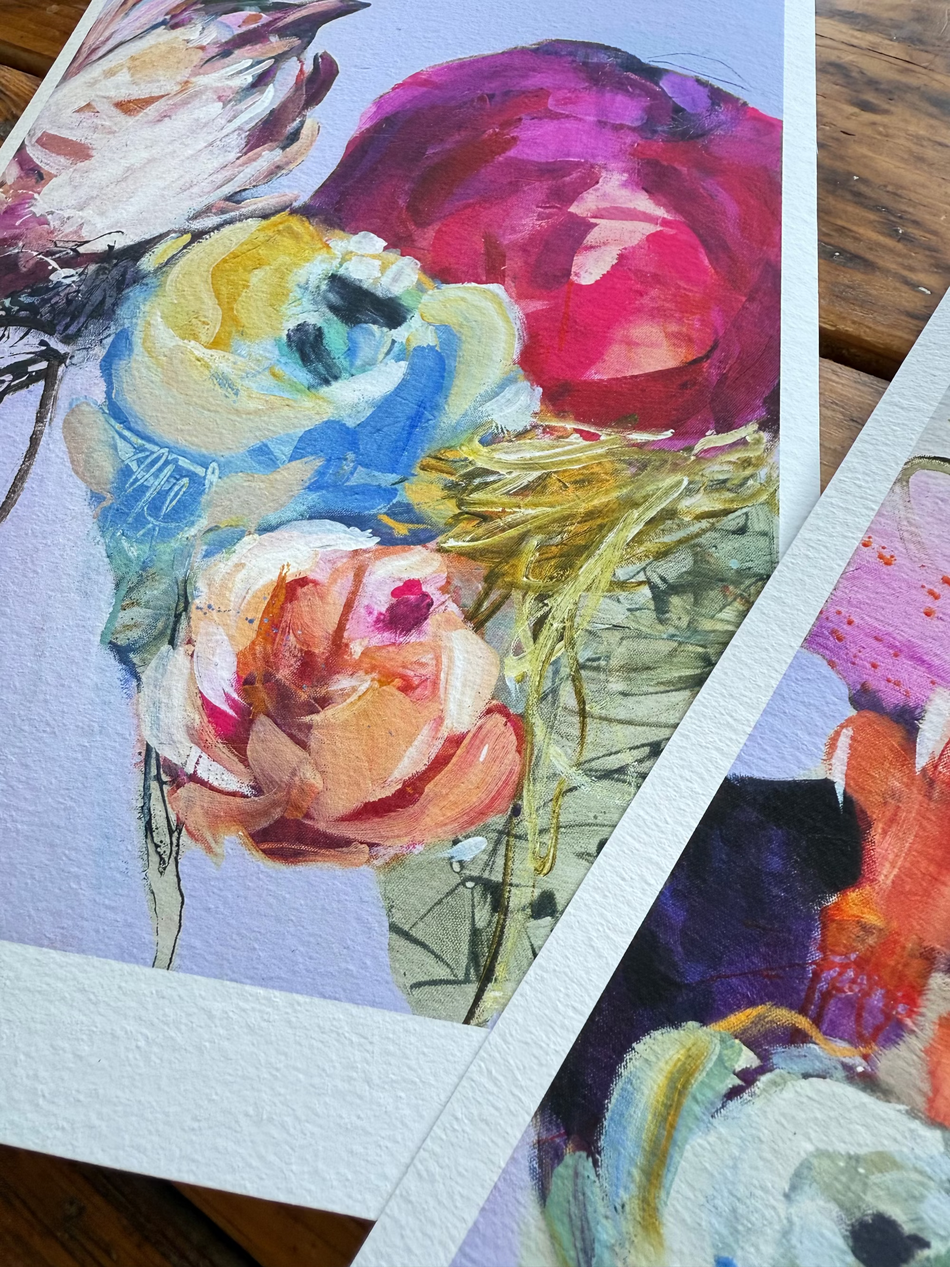 Colorful floral artwork on a wooden surface