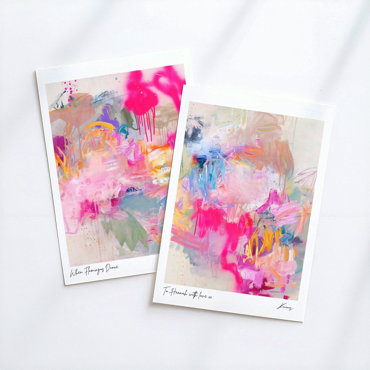 Two abstract art prints with colorful brush strokes on a white background